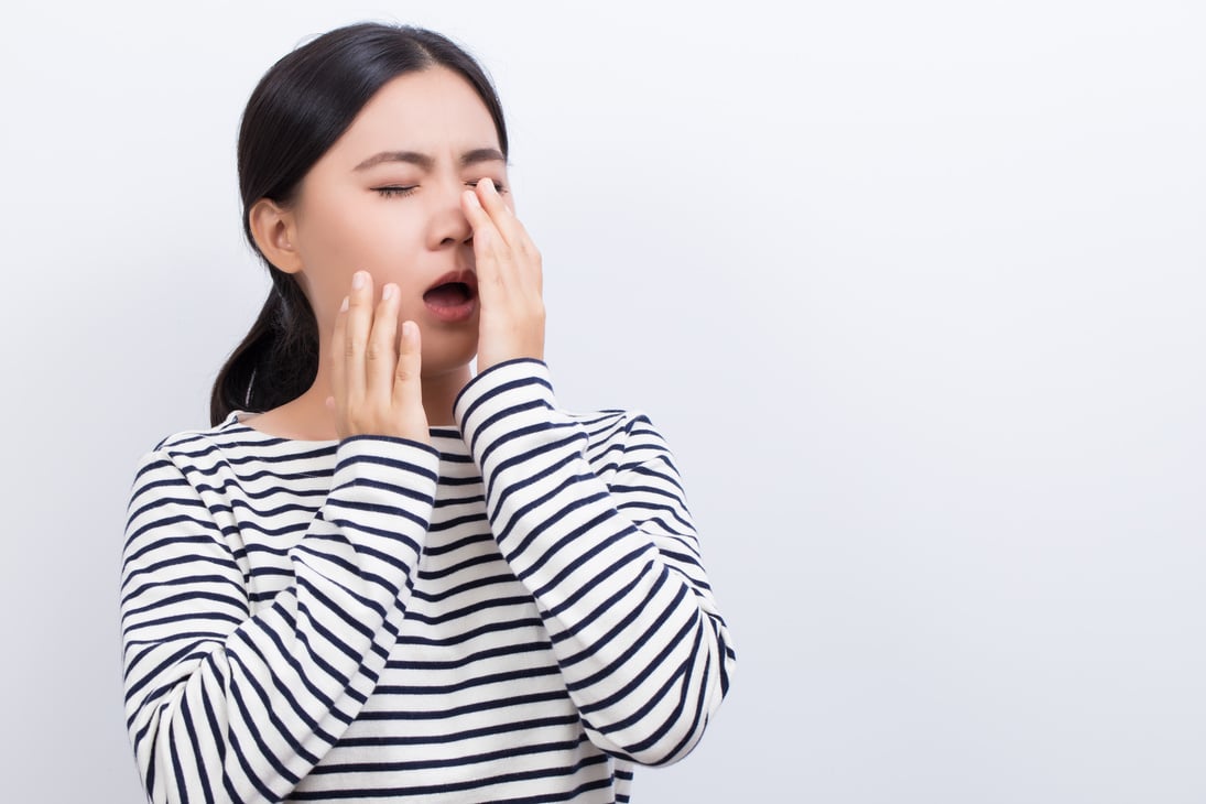 Woman Sneezing